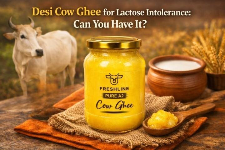 Jar of desi cow ghee with spoon on wooden table